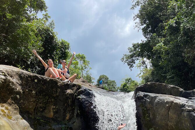 El Yunque Rainforest Tour with Waterslides and Beach - Stop 1 at El Yunque Peak: hike time, history talk, and water-slide action