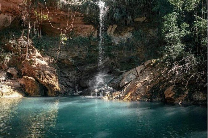 Full-Day Gozalandia Private Tour in Puerto Rico - Stop 2: La Poza del Obispo wave-breaker swimming by the lighthouse