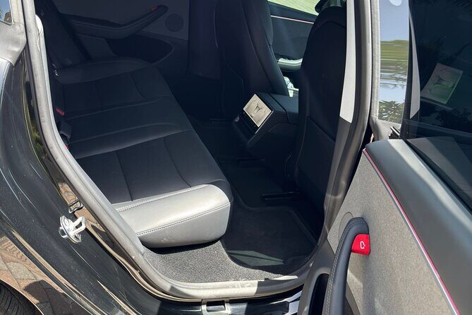 Puerto Rico Island Wide Private Transfers, Tesla 3 Luxury Sedan. - What pickup feels like at SJU and the cruise port
