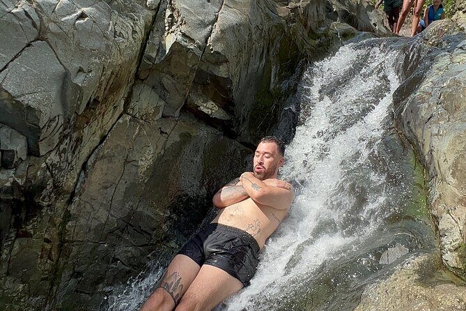 The Best El Yunque Adventure - Transport Included - Rope swing and cliff jumps: safety-first fun with a lifejacket