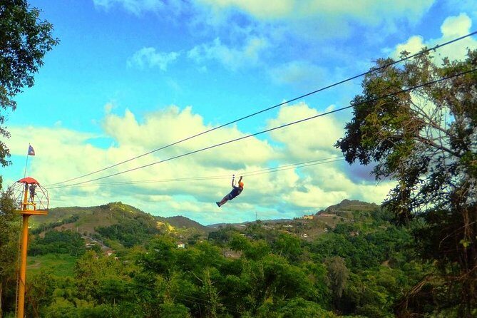 Zipline Canopy Tour with Transport from San Juan - Gear up fast: training, harness fitting, and real safety